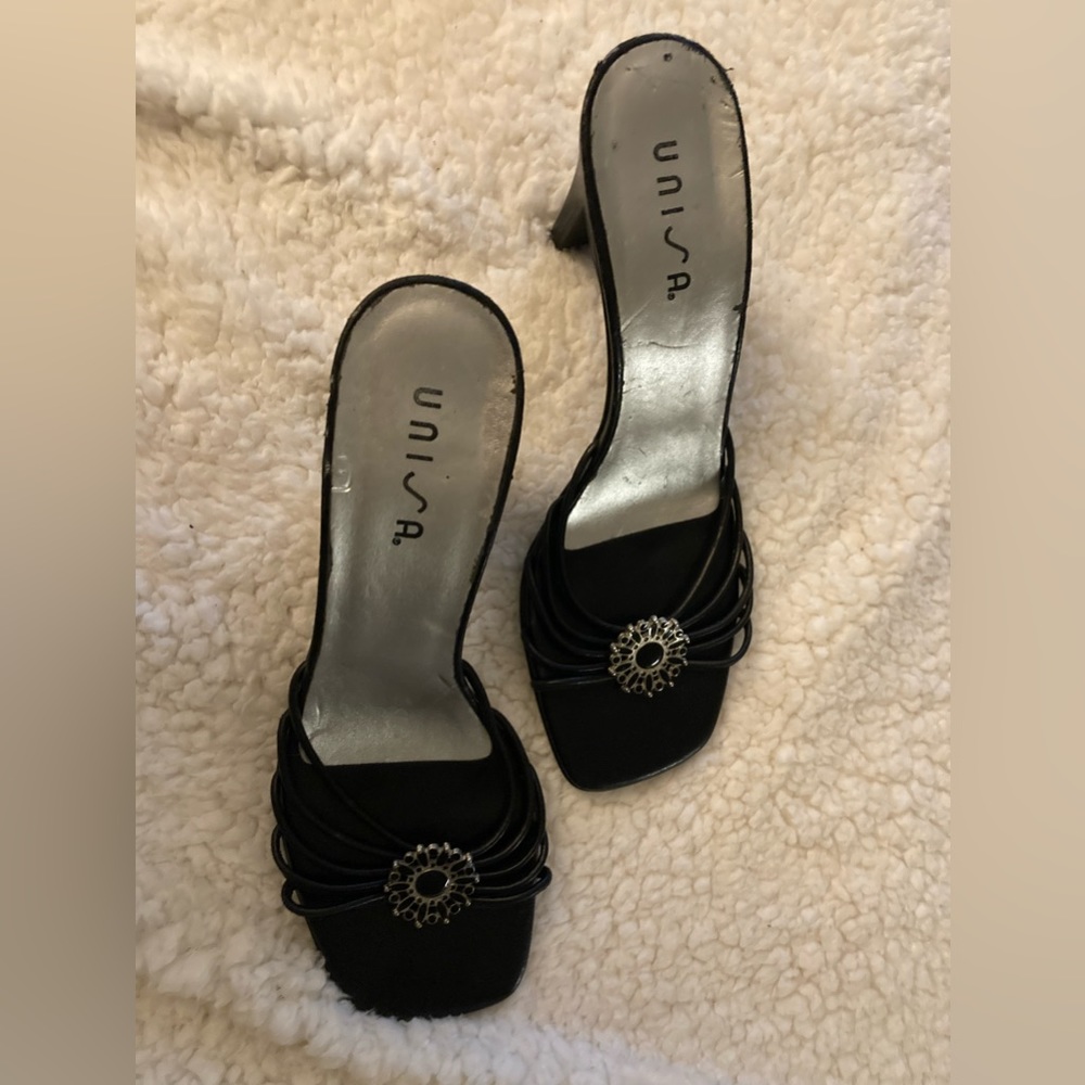 Unisa Black leather Sandals Heels with Design Emblishment on front.